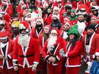 In Krakow, Poland, on December 8, 2024, motorcyclists in Santa costumes hand out gifts at the University Children's Hospital. Santas on moto...