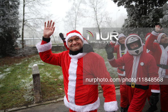 Motorcyclists in Santa costumes greet sick children while handing out gifts at the University Children's Hospital in Krakow, Poland, on Dece...