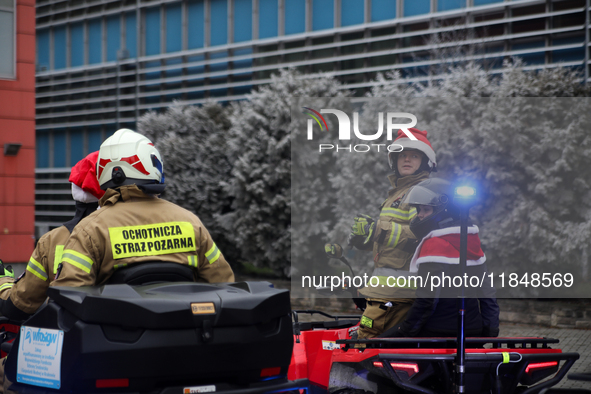 In Krakow, Poland, on December 8, 2024, the Volunteer Fire Department greets sick children while handing out gifts at the University Childre...