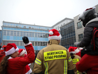 Motorcyclists in Santa costumes greet sick children while handing out gifts at the University Children's Hospital in Krakow, Poland, on Dece...