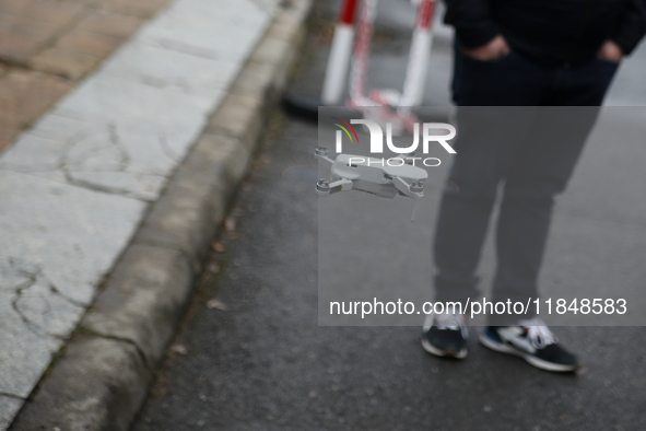 In Krakow, Poland, on December 8, 2024, a drone flies during a gift handout at the University Children's Hospital. Santas on motorbikes ride...