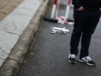 In Krakow, Poland, on December 8, 2024, a drone flies during a gift handout at the University Children's Hospital. Santas on motorbikes ride...