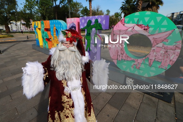 Miguel Moctezuma is characterized as Santa Claus Illuminated during his visit to some of the iconic places in the Tepito neighborhood as par...