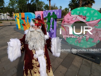 Miguel Moctezuma is characterized as Santa Claus Illuminated during his visit to some of the iconic places in the Tepito neighborhood as par...