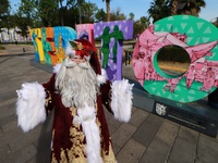 Miguel Moctezuma is characterized as Santa Claus Illuminated during his visit to some of the iconic places in the Tepito neighborhood as par...