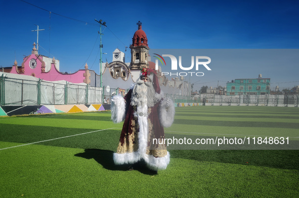 Miguel Moctezuma is characterized as Santa Claus Illuminated during his visit to some of the iconic places in the Tepito neighborhood as par...