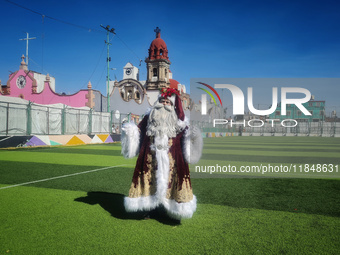 Miguel Moctezuma is characterized as Santa Claus Illuminated during his visit to some of the iconic places in the Tepito neighborhood as par...