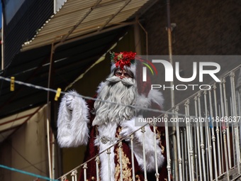 Miguel Moctezuma is characterized as Santa Claus Illuminated during his visit to some of the iconic places in the Tepito neighborhood as par...