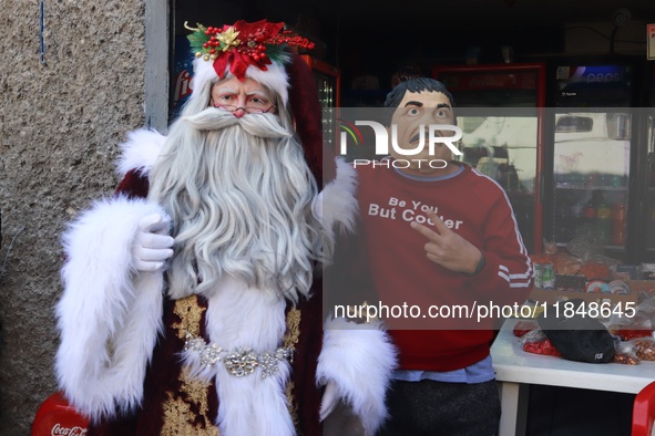 Miguel Moctezuma is characterized as Santa Claus Illuminated during his visit to some of the iconic places in the Tepito neighborhood as par...