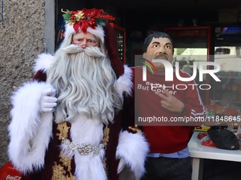 Miguel Moctezuma is characterized as Santa Claus Illuminated during his visit to some of the iconic places in the Tepito neighborhood as par...