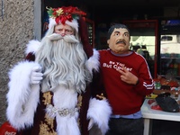 Miguel Moctezuma is characterized as Santa Claus Illuminated during his visit to some of the iconic places in the Tepito neighborhood as par...