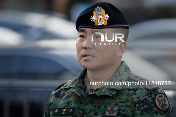 Colonel Kim Hyun-tae, Commander of the 707th Special Mission Group, holds a press conference in front of the Defense Convention Center in Yo...