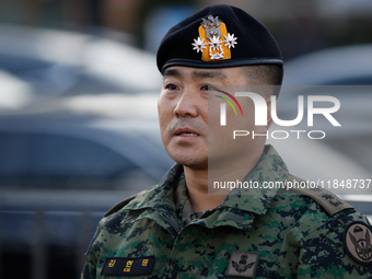 Colonel Kim Hyun-tae, Commander of the 707th Special Mission Group, holds a press conference in front of the Defense Convention Center in Yo...