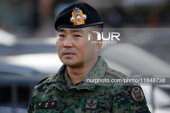 Colonel Kim Hyun-tae, Commander of the 707th Special Mission Group, holds a press conference in front of the Defense Convention Center in Yo...