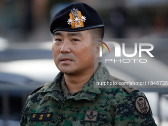 Colonel Kim Hyun-tae, Commander of the 707th Special Mission Group, holds a press conference in front of the Defense Convention Center in Yo...