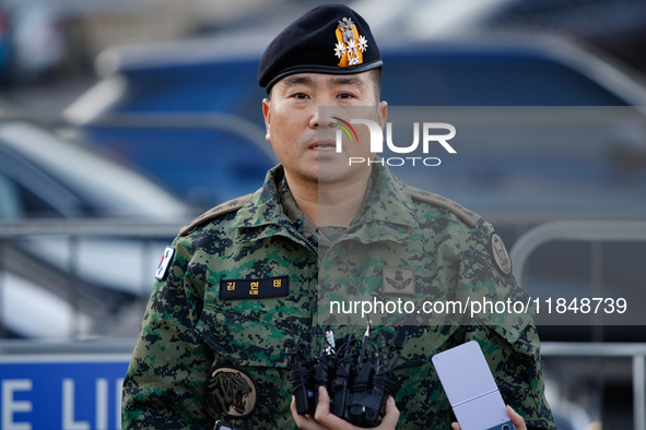 Colonel Kim Hyun-tae, Commander of the 707th Special Mission Group, holds a press conference in front of the Defense Convention Center in Yo...