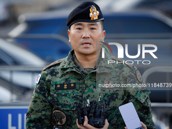 Colonel Kim Hyun-tae, Commander of the 707th Special Mission Group, holds a press conference in front of the Defense Convention Center in Yo...