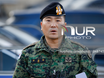 Colonel Kim Hyun-tae, Commander of the 707th Special Mission Group, holds a press conference in front of the Defense Convention Center in Yo...