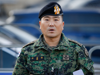 Colonel Kim Hyun-tae, Commander of the 707th Special Mission Group, holds a press conference in front of the Defense Convention Center in Yo...