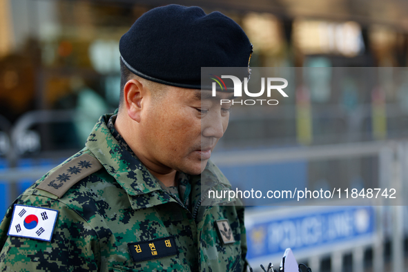 Colonel Kim Hyun-tae, Commander of the 707th Special Mission Group, holds a press conference in front of the Defense Convention Center in Yo...