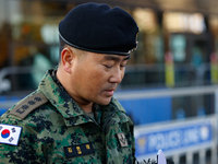 Colonel Kim Hyun-tae, Commander of the 707th Special Mission Group, holds a press conference in front of the Defense Convention Center in Yo...