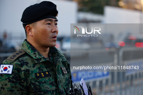 Colonel Kim Hyun-tae, Commander of the 707th Special Mission Group, holds a press conference in front of the Defense Convention Center in Yo...