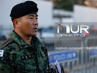 Colonel Kim Hyun-tae, Commander of the 707th Special Mission Group, holds a press conference in front of the Defense Convention Center in Yo...