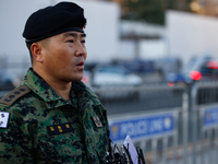 Colonel Kim Hyun-tae, Commander of the 707th Special Mission Group, holds a press conference in front of the Defense Convention Center in Yo...