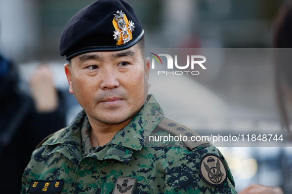 Colonel Kim Hyun-tae, Commander of the 707th Special Mission Group, holds a press conference in front of the Defense Convention Center in Yo...