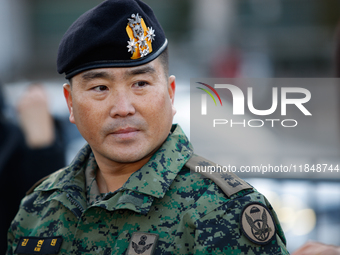 Colonel Kim Hyun-tae, Commander of the 707th Special Mission Group, holds a press conference in front of the Defense Convention Center in Yo...