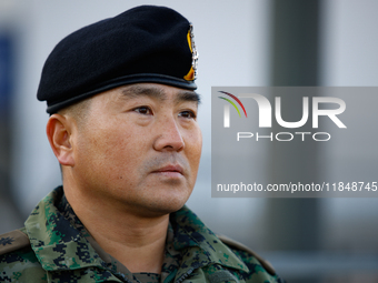 Colonel Kim Hyun-tae, Commander of the 707th Special Mission Group, holds a press conference in front of the Defense Convention Center in Yo...