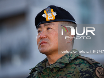 Colonel Kim Hyun-tae, Commander of the 707th Special Mission Group, sheds tears during a press conference in front of the Defense Convention...