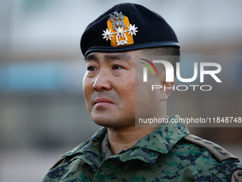 Colonel Kim Hyun-tae, Commander of the 707th Special Mission Group, sheds tears during a press conference in front of the Defense Convention...