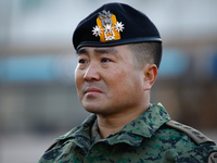 Colonel Kim Hyun-tae, Commander of the 707th Special Mission Group, sheds tears during a press conference in front of the Defense Convention...