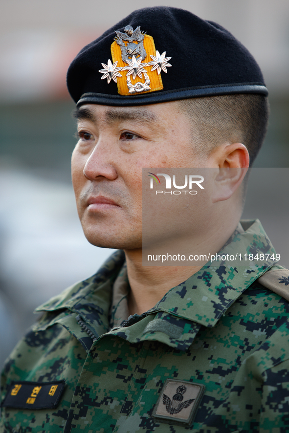 Colonel Kim Hyun-tae, Commander of the 707th Special Mission Group, sheds tears during a press conference in front of the Defense Convention...