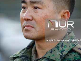 Colonel Kim Hyun-tae, Commander of the 707th Special Mission Group, sheds tears during a press conference in front of the Defense Convention...