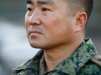 Colonel Kim Hyun-tae, Commander of the 707th Special Mission Group, sheds tears during a press conference in front of the Defense Convention...