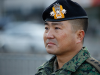 Colonel Kim Hyun-tae, Commander of the 707th Special Mission Group, sheds tears during a press conference in front of the Defense Convention...