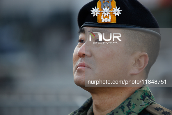 Colonel Kim Hyun-tae, Commander of the 707th Special Mission Group, sheds tears during a press conference in front of the Defense Convention...