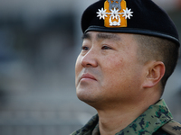 Colonel Kim Hyun-tae, Commander of the 707th Special Mission Group, sheds tears during a press conference in front of the Defense Convention...