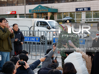 Colonel Kim Hyun-tae, Commander of the 707th Special Mission Group, holds a press conference in front of the Defense Convention Center in Yo...