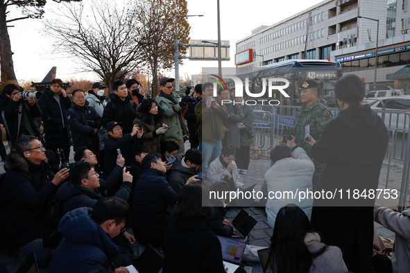 Colonel Kim Hyun-tae, Commander of the 707th Special Mission Group, holds a press conference in front of the Defense Convention Center in Yo...