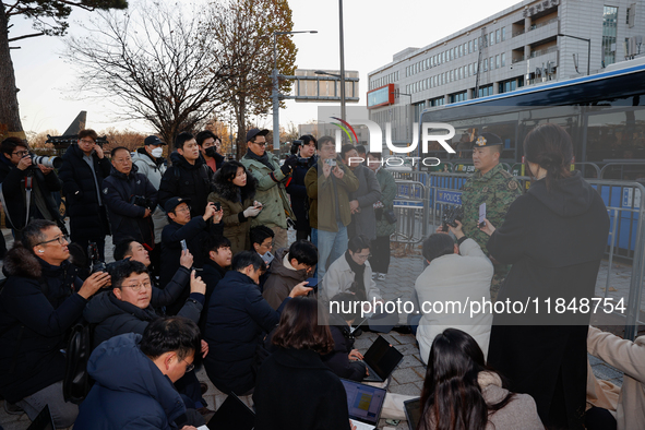 Colonel Kim Hyun-tae, Commander of the 707th Special Mission Group, holds a press conference in front of the Defense Convention Center in Yo...