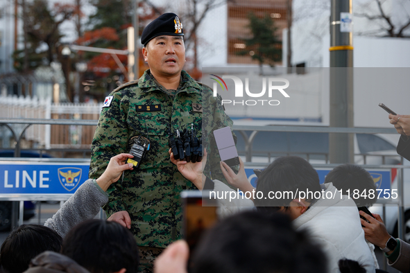 Colonel Kim Hyun-tae, Commander of the 707th Special Mission Group, holds a press conference in front of the Defense Convention Center in Yo...