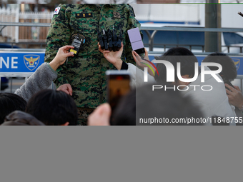 Colonel Kim Hyun-tae, Commander of the 707th Special Mission Group, holds a press conference in front of the Defense Convention Center in Yo...