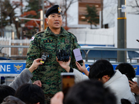 Colonel Kim Hyun-tae, Commander of the 707th Special Mission Group, holds a press conference in front of the Defense Convention Center in Yo...