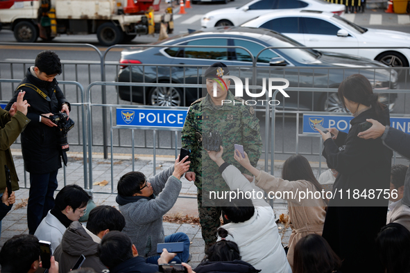 Colonel Kim Hyun-tae, Commander of the 707th Special Mission Group, holds a press conference in front of the Defense Convention Center in Yo...