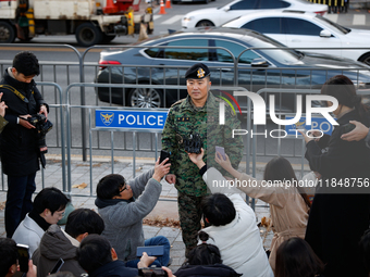 Colonel Kim Hyun-tae, Commander of the 707th Special Mission Group, holds a press conference in front of the Defense Convention Center in Yo...