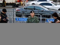 Colonel Kim Hyun-tae, Commander of the 707th Special Mission Group, holds a press conference in front of the Defense Convention Center in Yo...