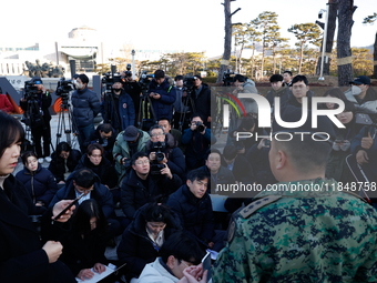 Colonel Kim Hyun-tae, Commander of the 707th Special Mission Group, holds a press conference in front of the Defense Convention Center in Yo...